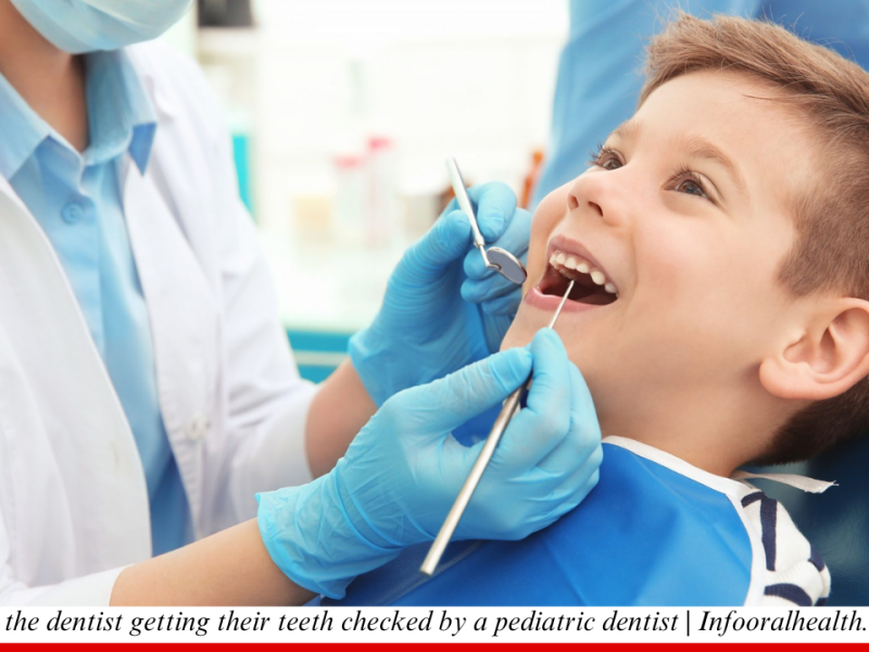 Child at the dentist getting their teeth checked by a pediatric dentist Infooralhealth.com